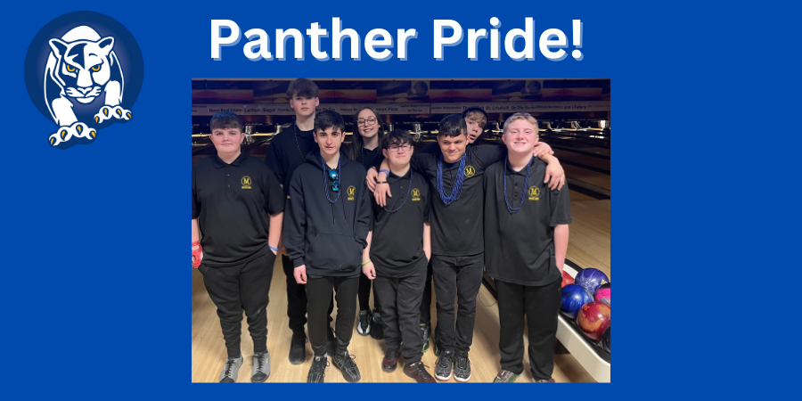 Bowling team standing together at bowling alley