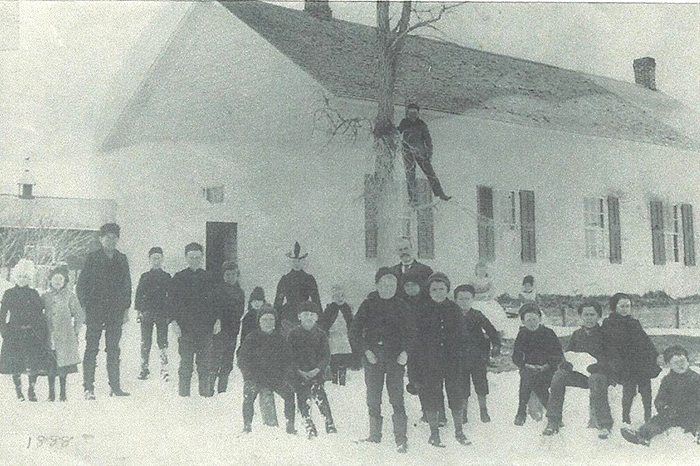 Riceville school in winter of 1888 with children outside