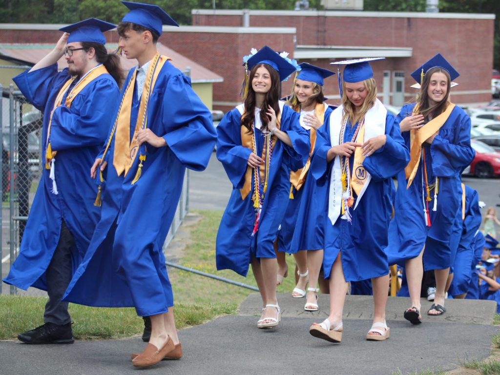 Graduates walking and smiling