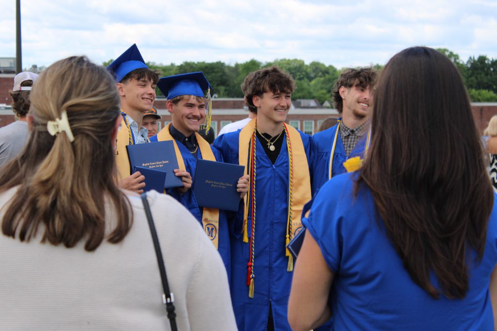 Graduates smile for photo