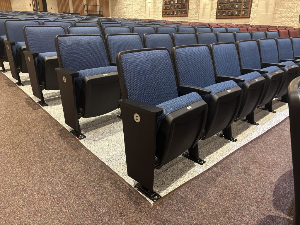 Rows of blue auditorium seating
