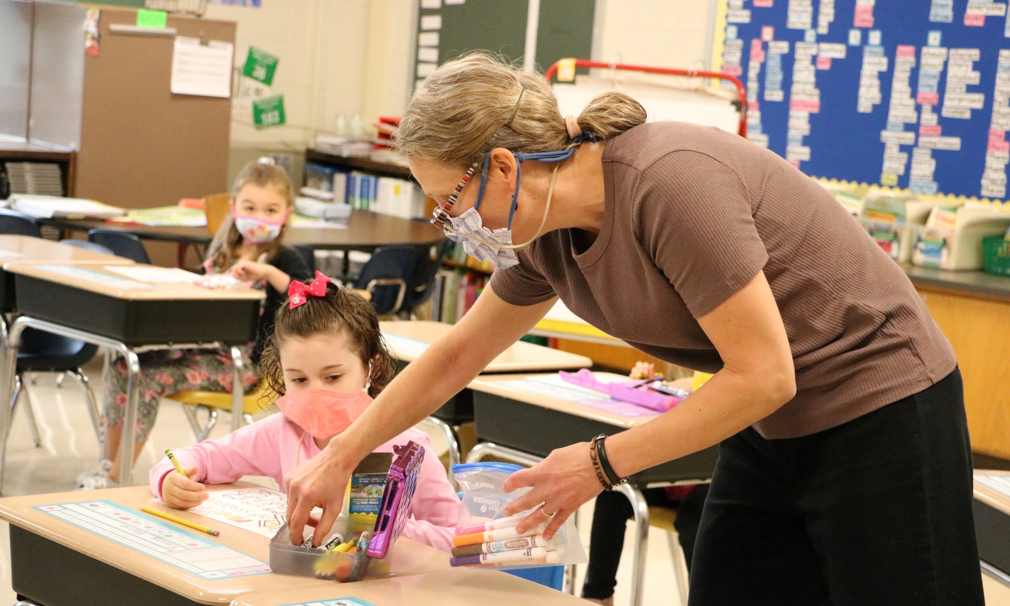 Students with teachers in classroom