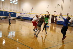 Students playing in the gym