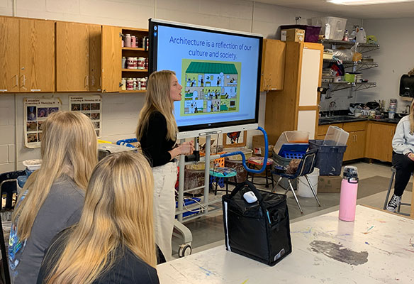 Nicole talking to students in a classroom