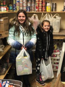 Sisters sorting through donated items