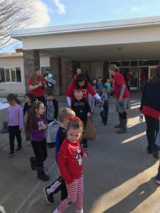 Students taking the toys outside