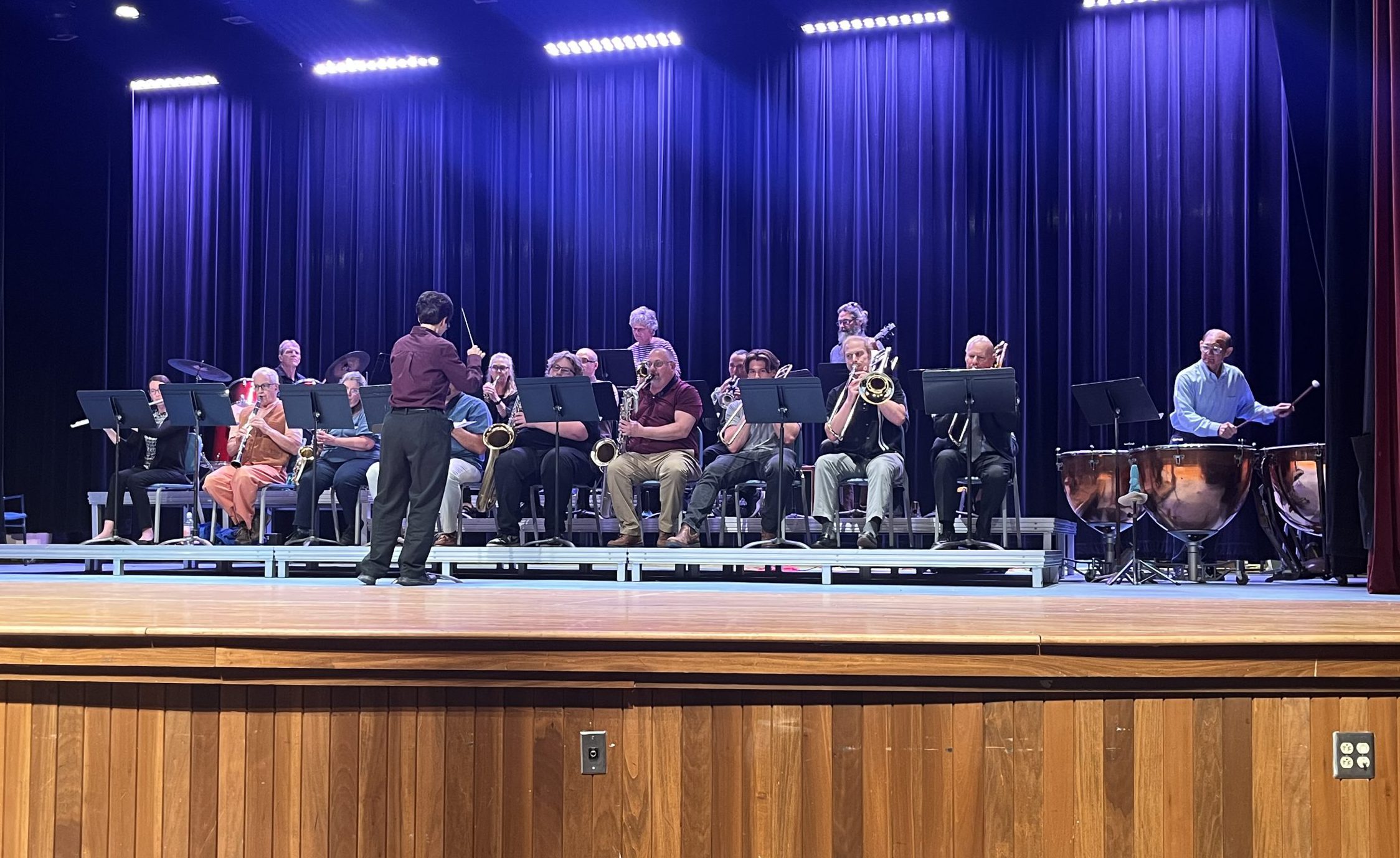 band playing on stage under lights