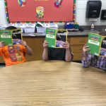 Three students reading books