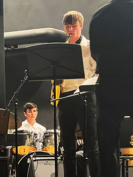 student playing saxophone