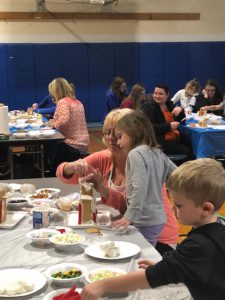 Students are joined by parents to make the houses