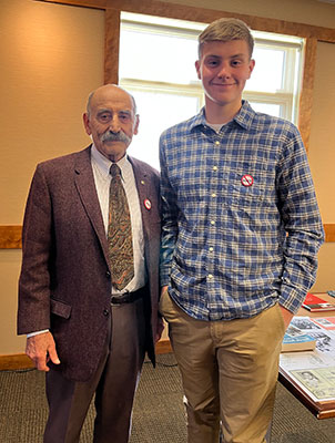 Mr. Vamos and a student, standing