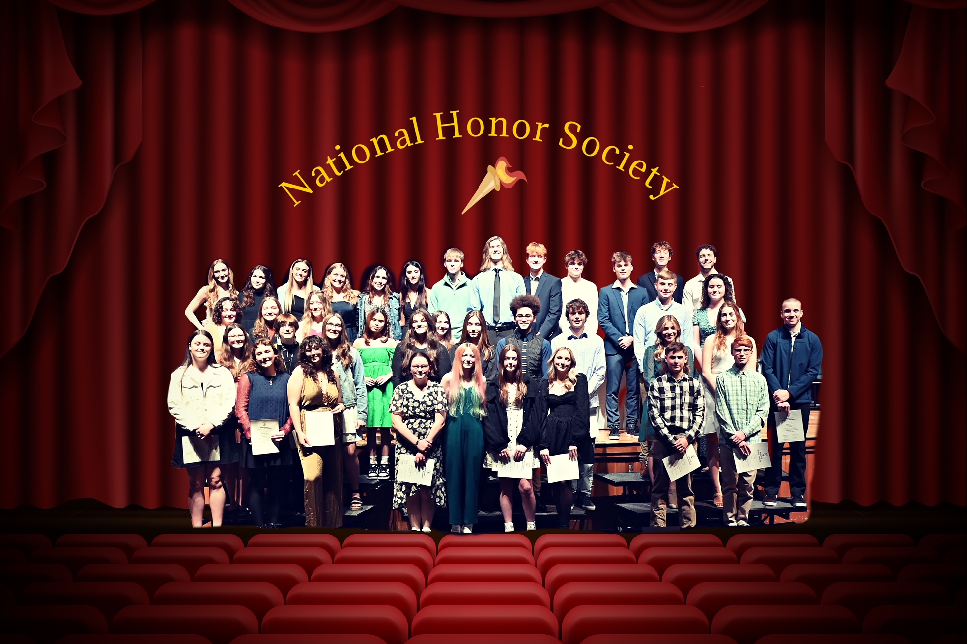 three rows of students standing in front of stage curtain with National Honor Society logo above them