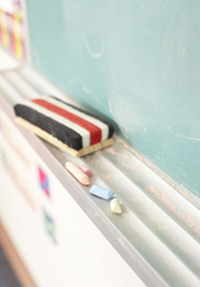 Graphic of an eraser on a chalkboard