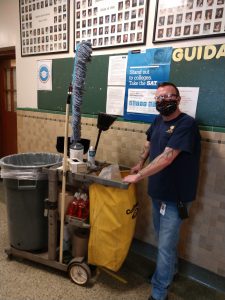 custodian working in hallway