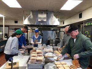 Administrators packing meals