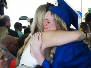 Student hugs parent