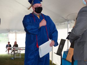 Student starts to fist bump administrator