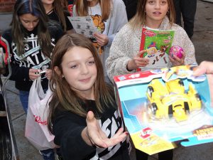 Students hands off a gift