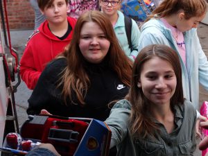 Student smiling with gifts