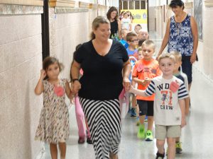 Students walking down the hallway