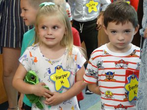 Young students hold hands