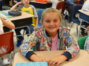 Student smiles in class