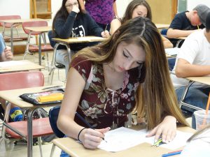 Student checking over work in class