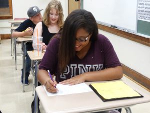 Student writing in class