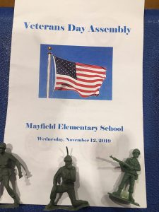 Sign introducing the veterans day program