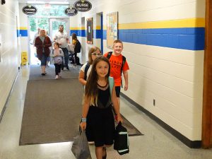 Students walking down the hallway at the elementary school