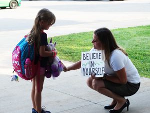 Staff member talking to a student