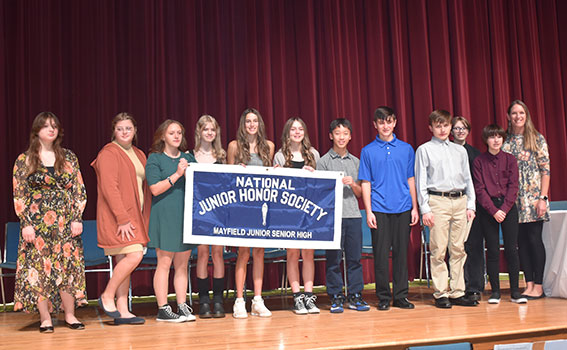 NJHS member students holding banner