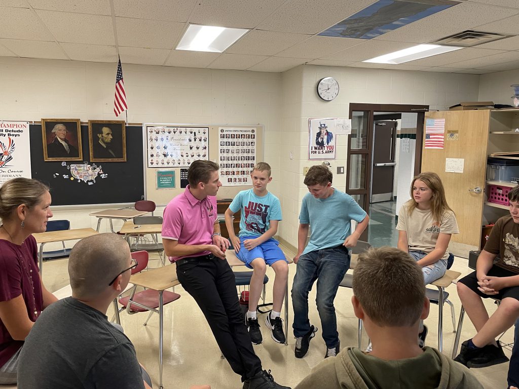 Pat Fish talking to students in a classroom