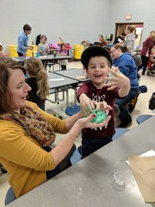 Student and parents check out the slime creation